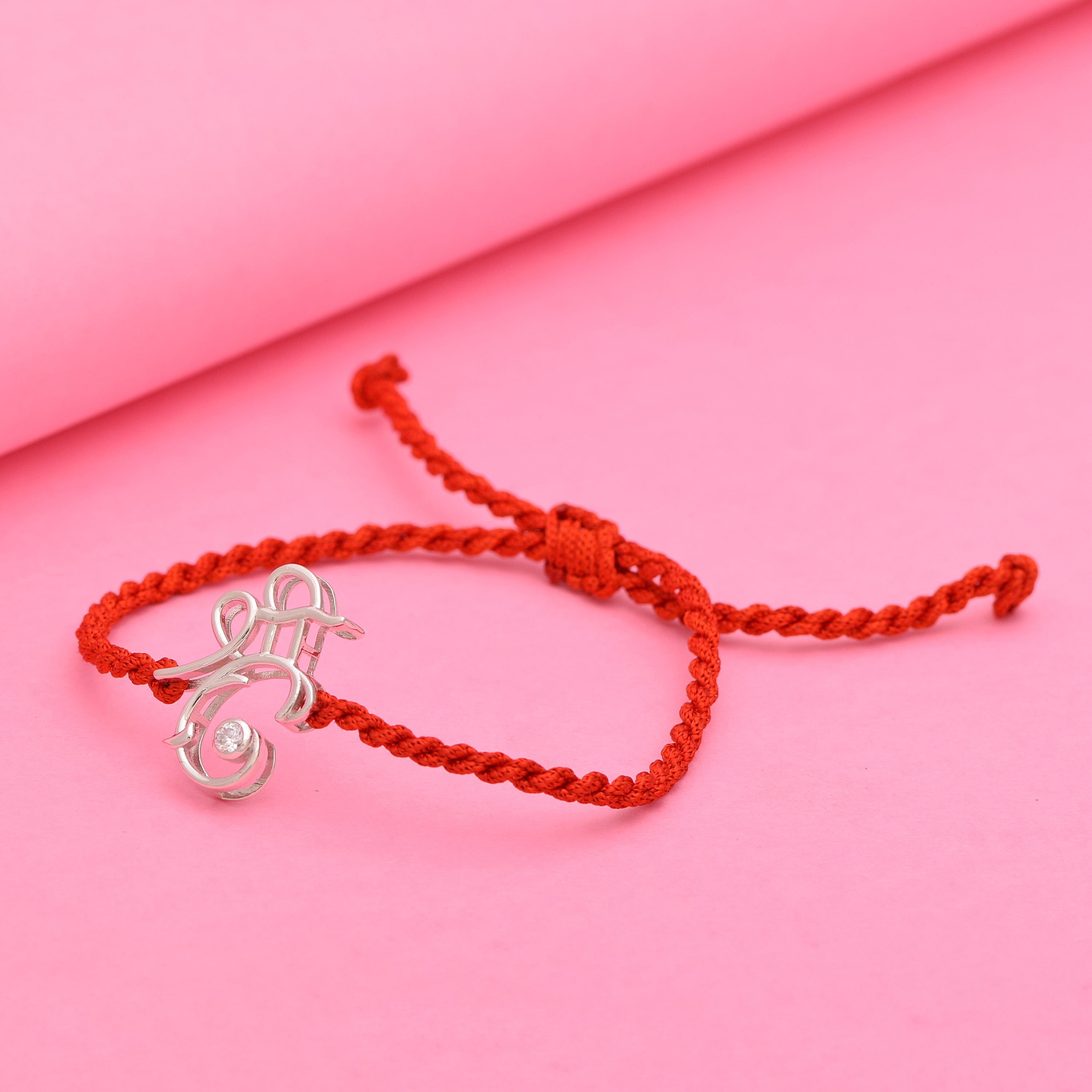 White CZ Ganesh Symbol Thread Rakhi Bracelet - Sterling Silver