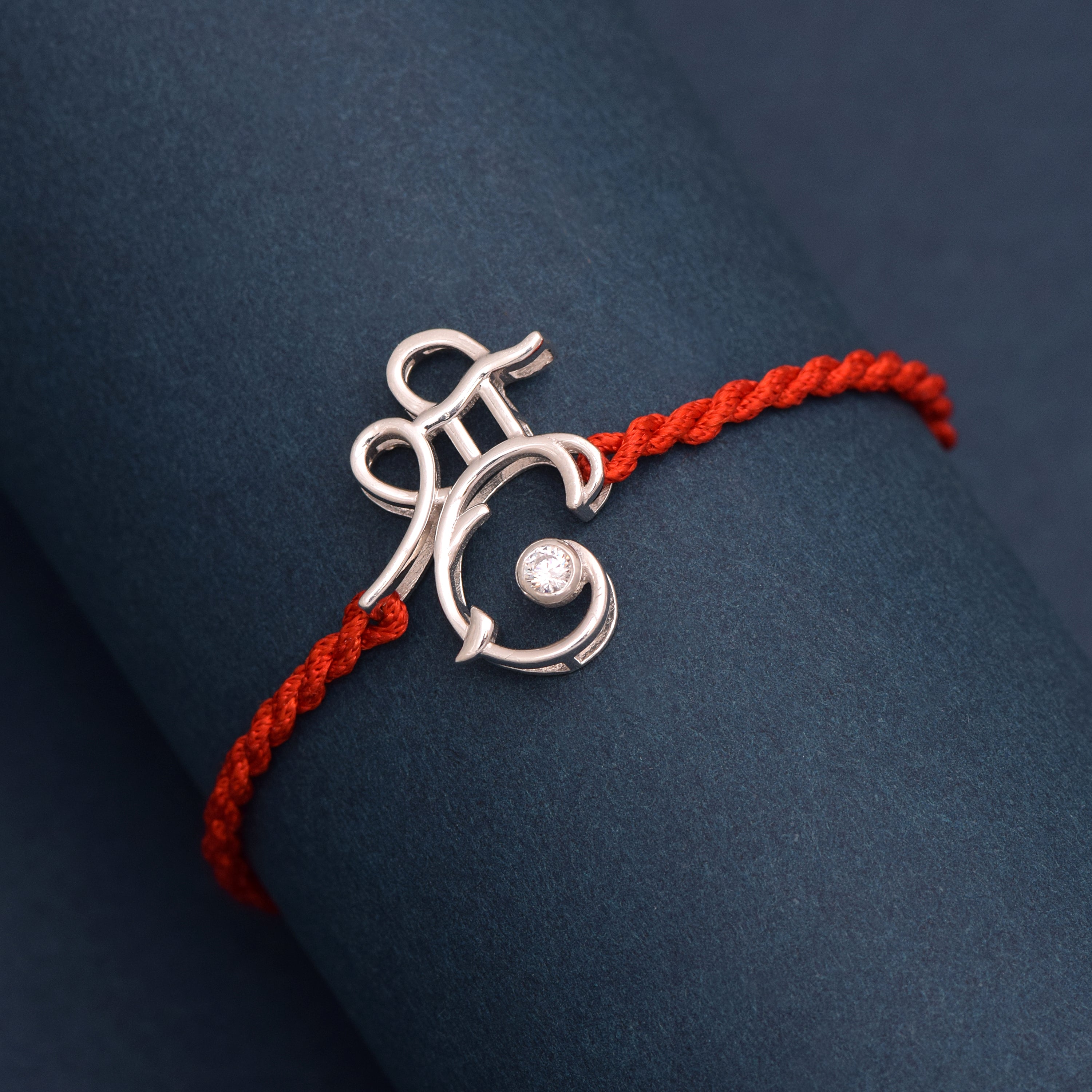 White CZ Ganesh Symbol Thread Rakhi Bracelet - Sterling Silver